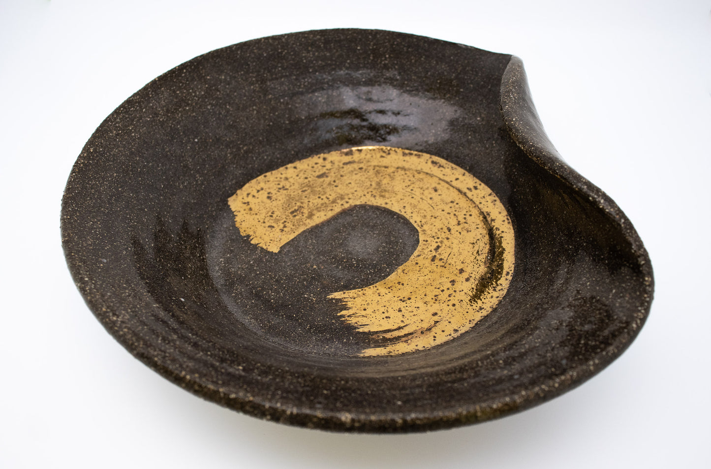 Gold luster on Black clay